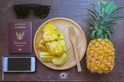 Set of Vacetion summer ; Pineapple, sunglasses, mobile phone and passport - Summer time vacation holiday healthy concept . photo