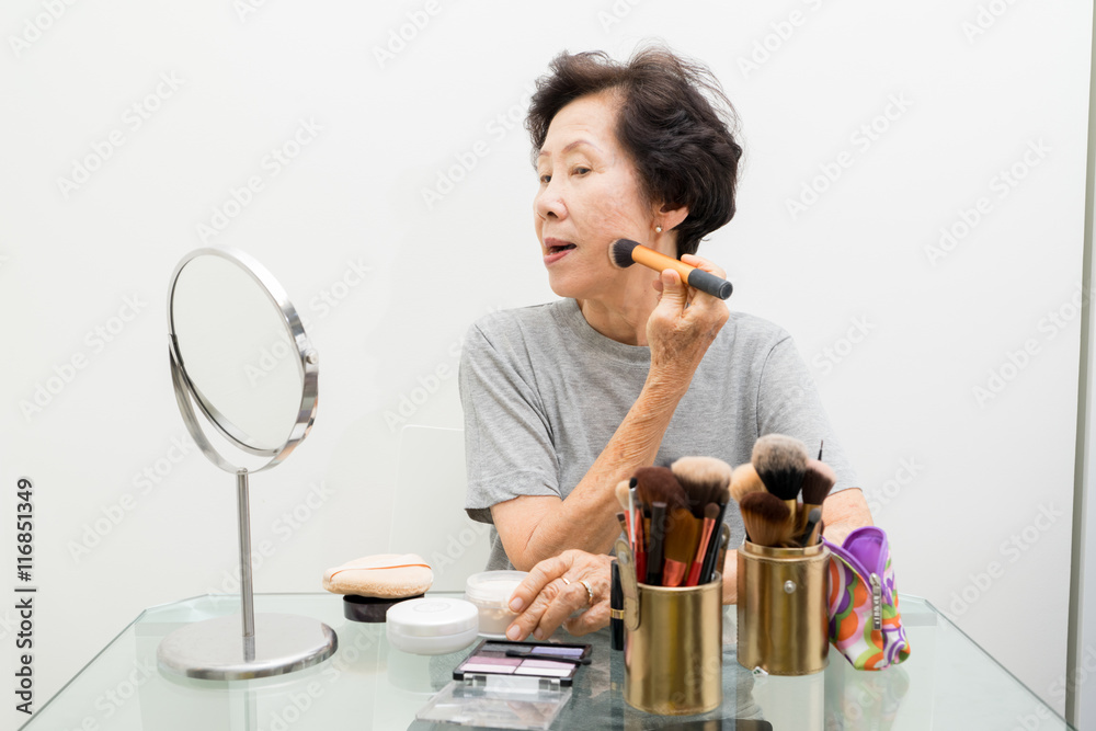 old woman applying make up,asian people, asian women old woman applying make up,asian people, asian women