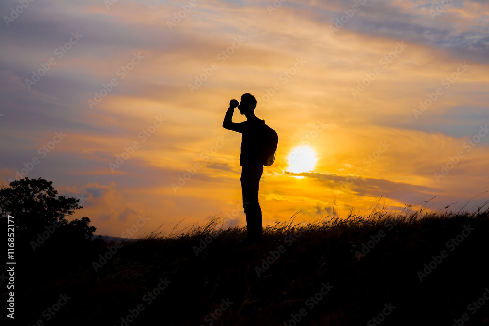 Follow your dreams, silhouette of man at sunset