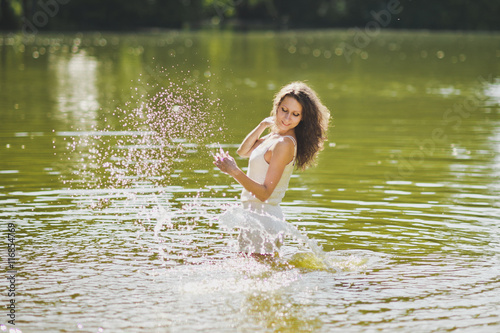 Happy fun with the water on the lake 6343. © alenazamotaeva