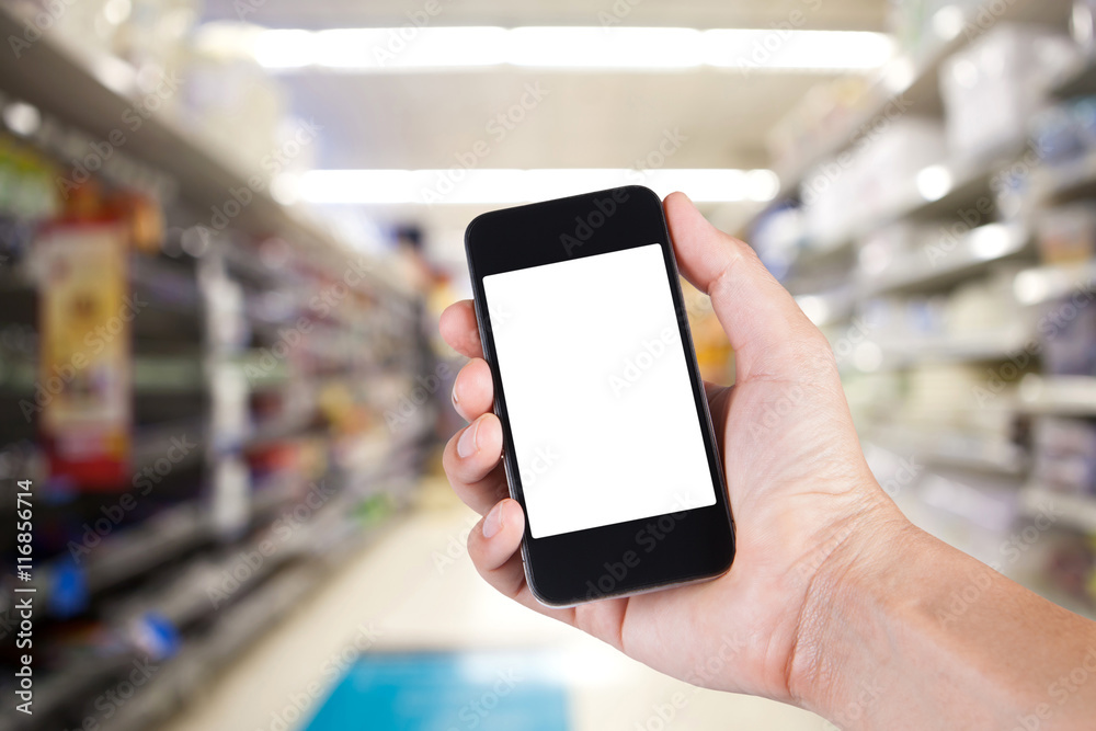 Person using smartphone white screen holder on hand with shelves Person using smartphone white screen holder on hand with shelves