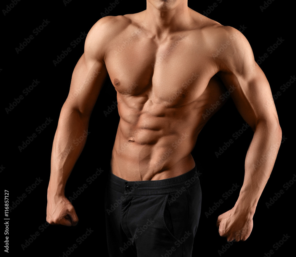 Muscular fitness man on black background Muscular fitness man on black background