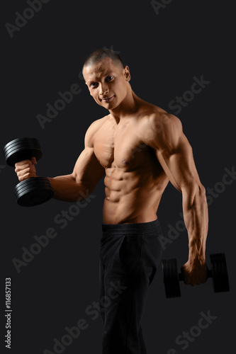 Male bodybuilder posing in studio