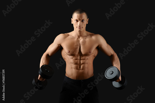 Male bodybuilder posing in studio photo