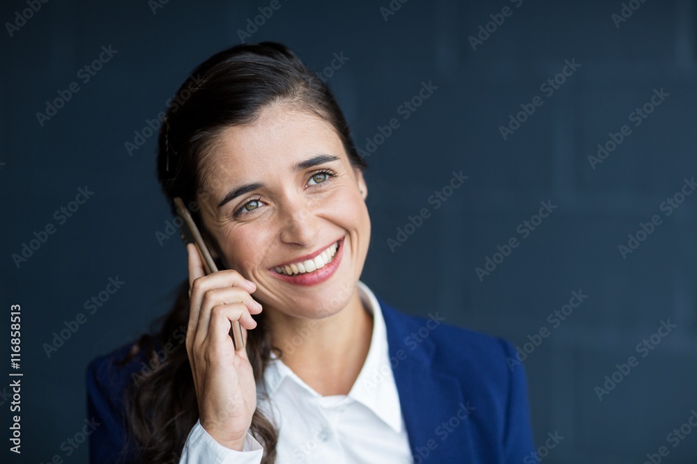 Smiling woman talking on phone