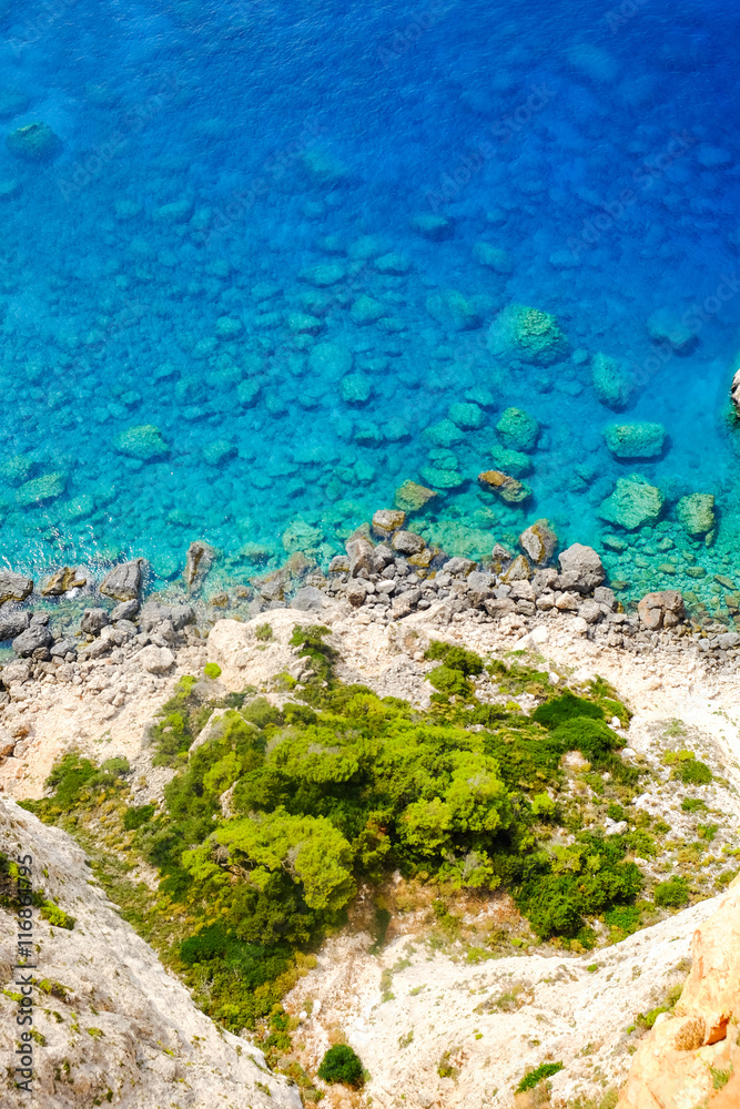 Obraz premium Rocky beach with clear blue waters on the island Zakynthos, Gree