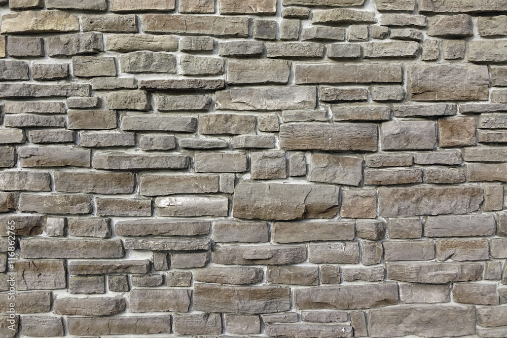 Fototapeta premium Modern Vintage Stone Wall From Stepped Granite Blocks Background