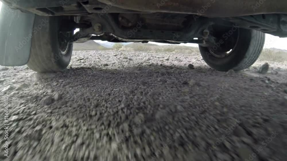 Camera mounted under a truck as it drives off-road. Camera mounted under a truck as it drives off-road.