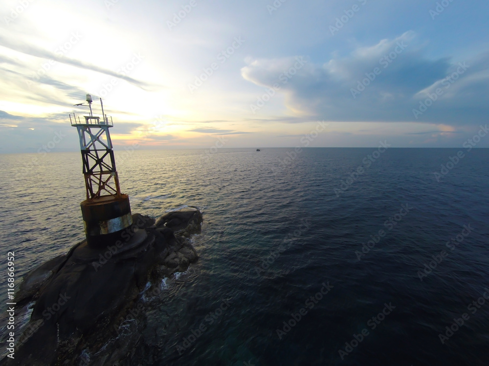 Ocean sea sunset view and lighthouse. Gulf of Thailand sea, Thailand, Wide angle view. Ocean sea sunset view and lighthouse. Gulf of Thailand sea, Thailand, Wide angle view.