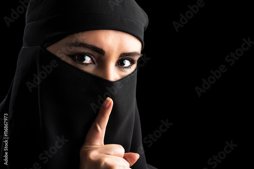 Muslim woman portrait with quiet symbol photo