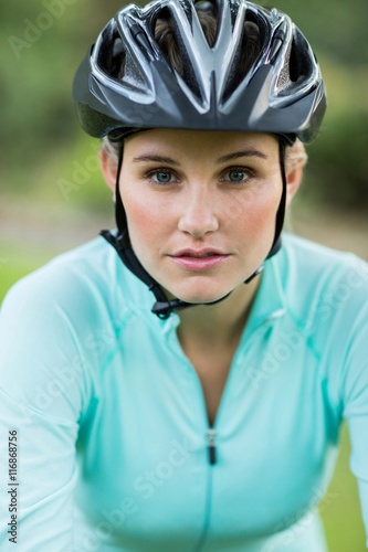 Female cyclist wearing bicycle helmet