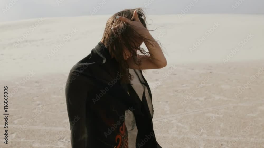 Young woman enjoy freedom at desert in summer day