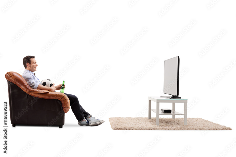 Fototapeta premium Man watching football on TV