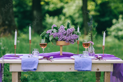 beautifully served table outdoor with flowers and decor