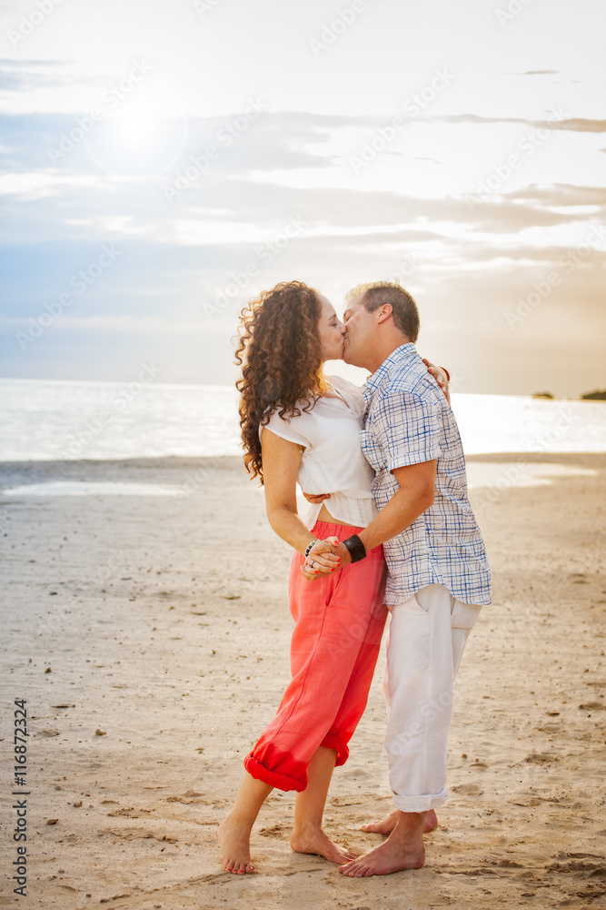Romantic Couple Kissing on the Beach Portrait Romantic Couple Kissing on the Beach Portrait