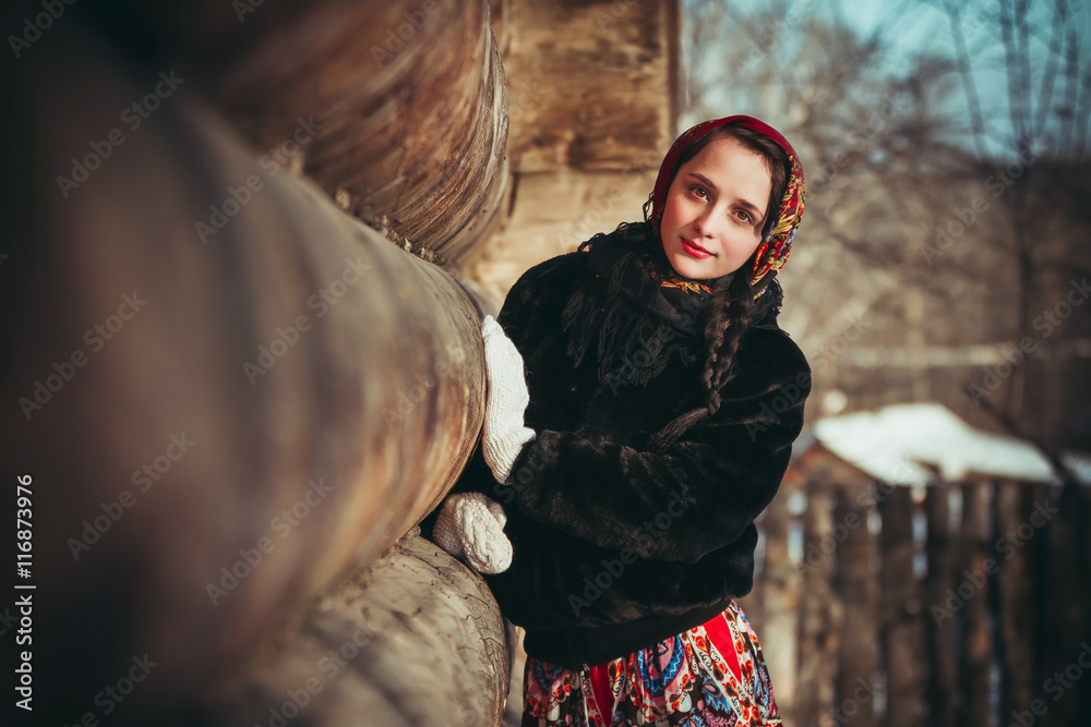 Russian girl in the village in winter Russian girl in the village in winter