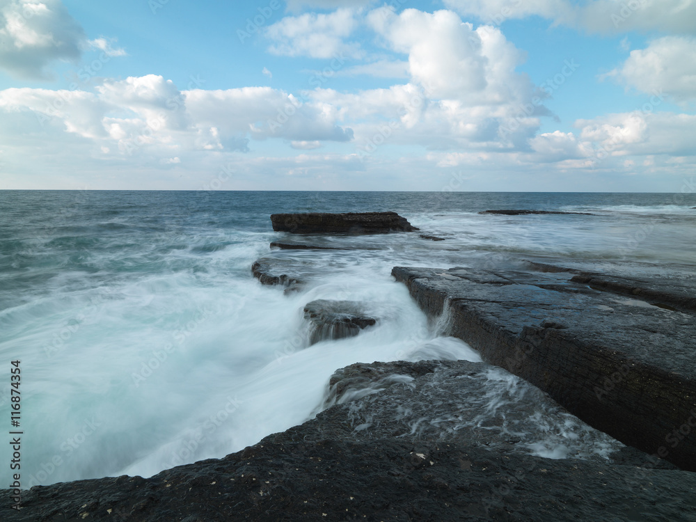 Long exposure shot on amazing rocks and sea waves