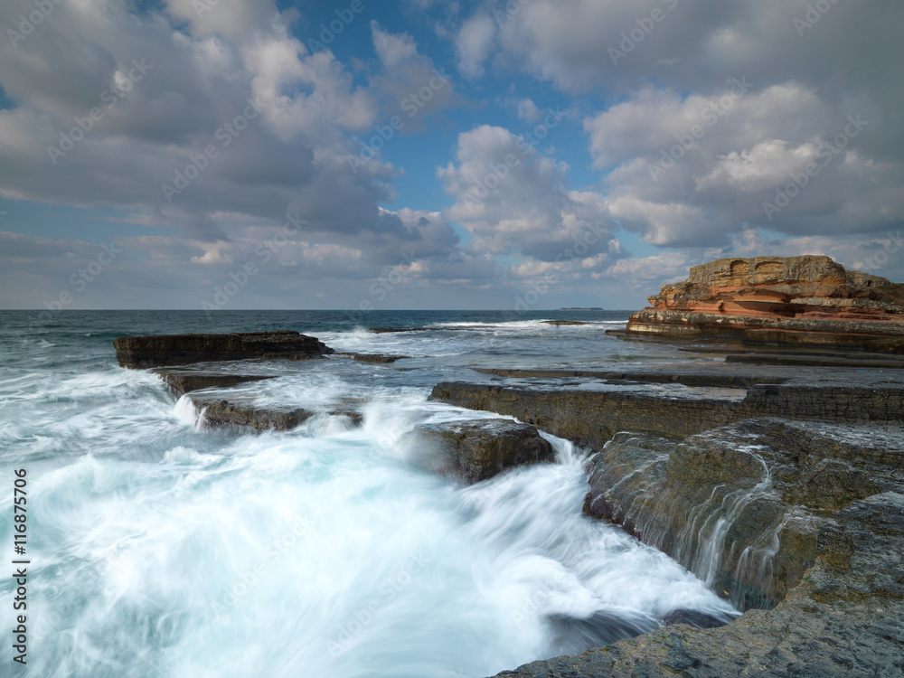 Long exposure shot on amazing rocks and sea waves
