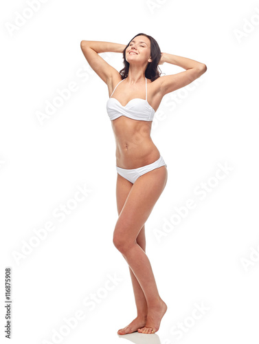 happy young woman in white bikini swimsuit