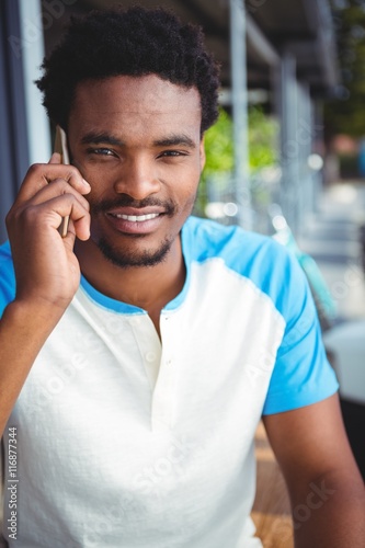 Smiling man talking on the mobile phone