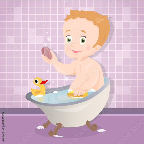 Cute baby boy smiling while talking a bath in bathroom