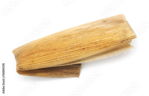 Isolated Mexican tamale on a white background.

