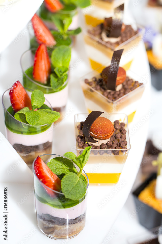 mini canapes in plastic cups decorated with edible flowers mini canapes in plastic cups decorated with edible flowers
