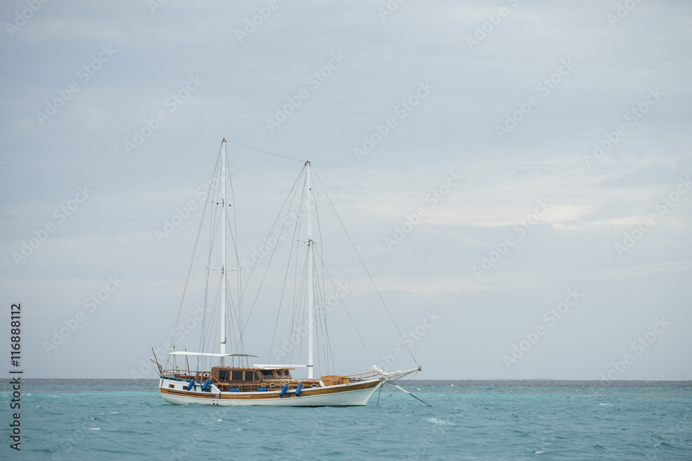 a sailboat mooring in Maldives