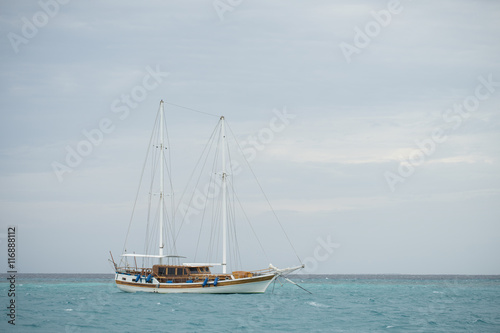 a sailboat mooring in Maldives