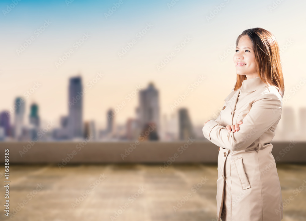 asian businesswoman arm crossed against cityscape background asian businesswoman arm crossed against cityscape background