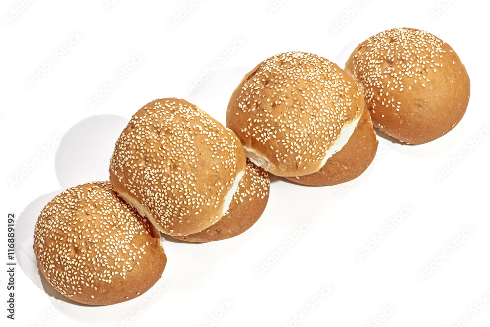 Golden Hamburger Rolls Arranged in Straight Line Golden Hamburger Rolls Arranged in Straight Line