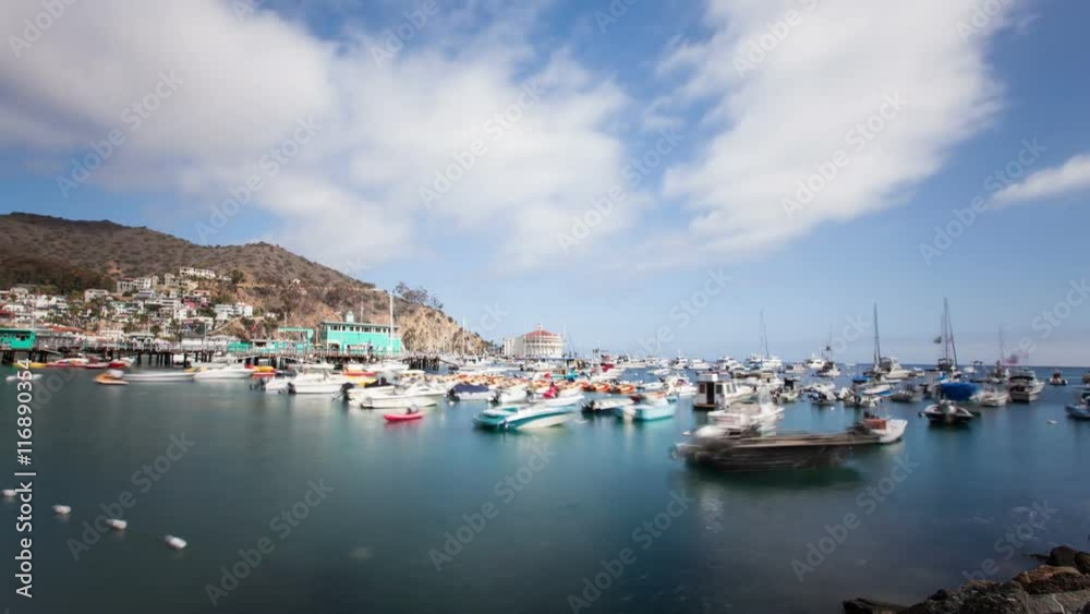 Looking down at the bay and town of Avalon on Catalina Island. Boat fill the harbor. Time Lapse Looking down at the bay and town of Avalon on Catalina Island. Boat fill the harbor. Time Lapse