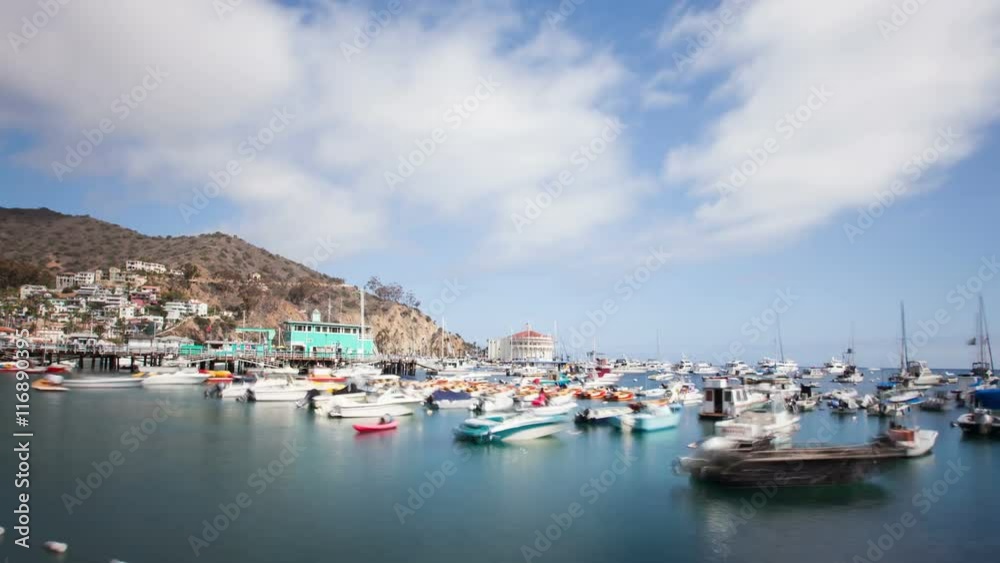 Looking down at the bay and town of Avalon on Catalina Island. Boat fill the harbor. Time Lapse. Looking down at the bay and town of Avalon on Catalina Island. Boat fill the harbor. Time Lapse.