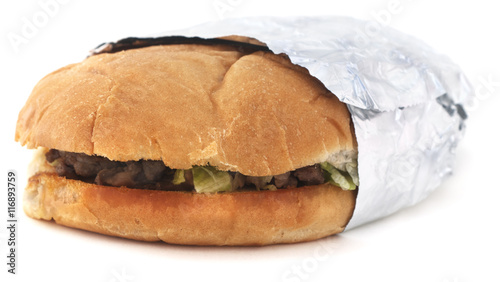 Isolated Mexican torta sandwich on a white background.