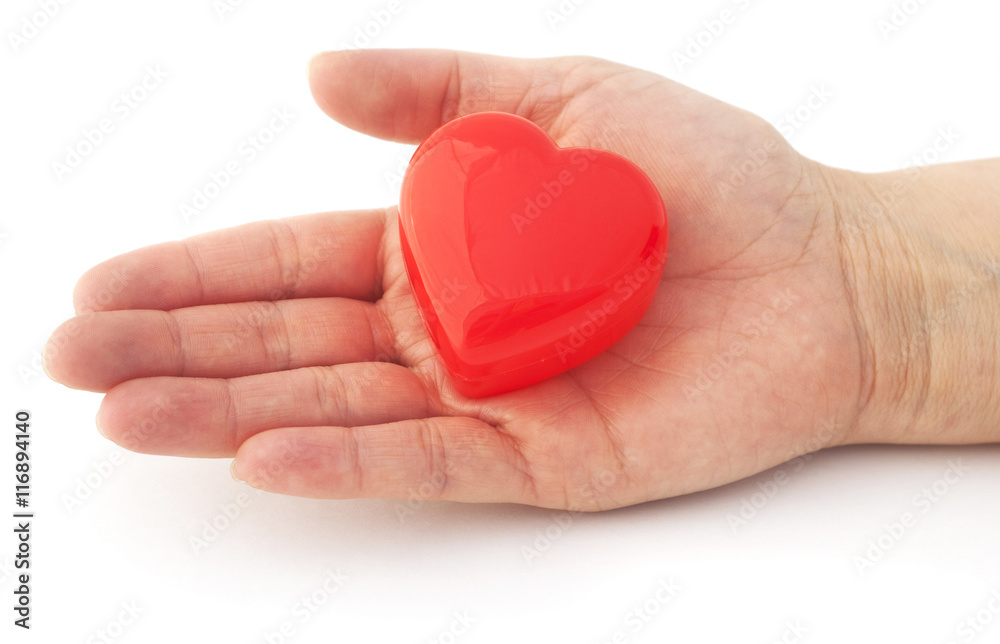 Obraz premium Isolated hand with a red heart. Helping hand.