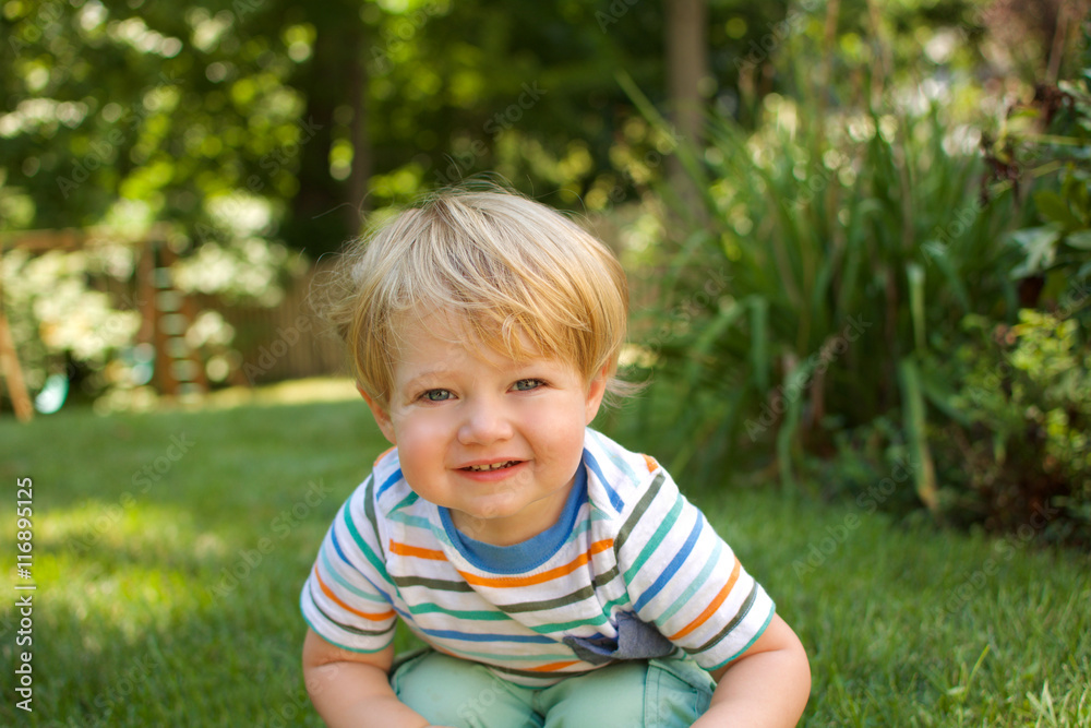young toddler boy smiling outdoors young toddler boy smiling outdoors