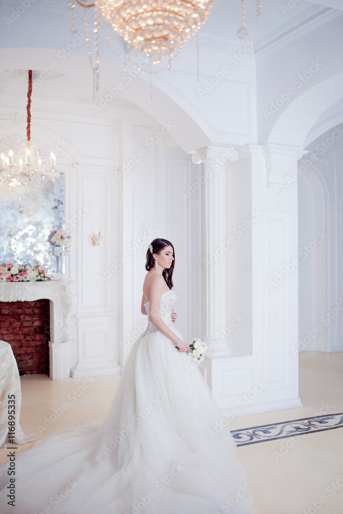 Fototapeta premium Portrait of beautiful bride. Wedding decoration. Luxurious light interior