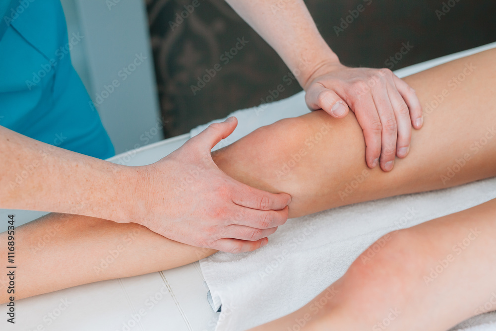 Doctor is examing his patient knee. Close up. Doctor is examing his patient knee. Close up.