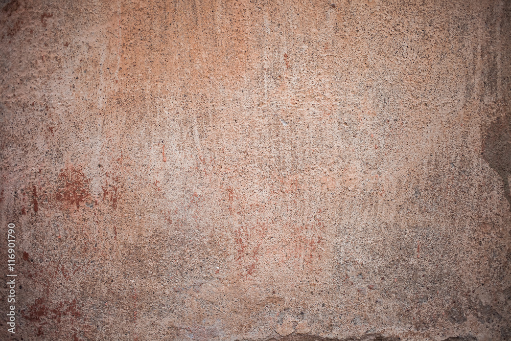 Obraz premium Fragment of an old red wall with a showered paint