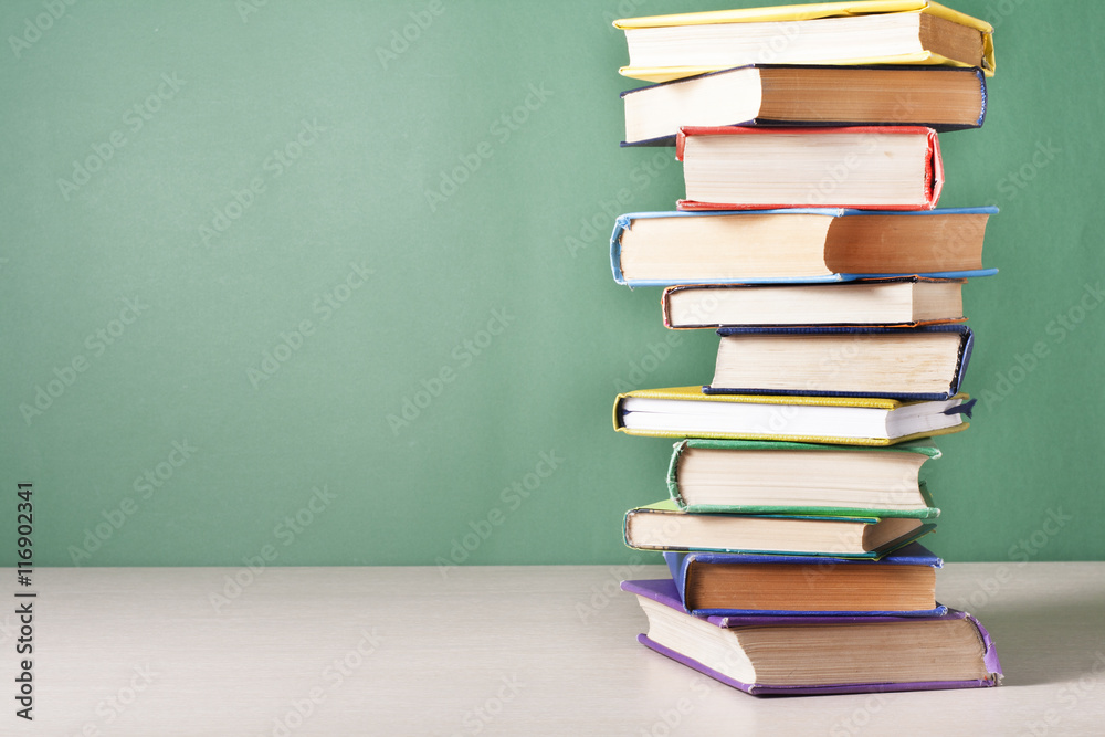 Obraz premium Stack of colorful books. Education background. Back to school. Copy space for text.