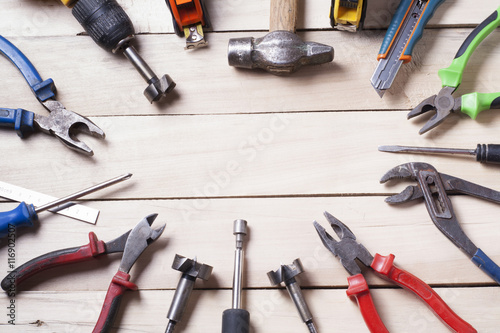 Construction tools on wooden background. Copy space for text. Set of assorted work tools. Top view