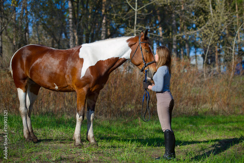 Girl sportswoman and her horse in the spring © sheikoevgeniya