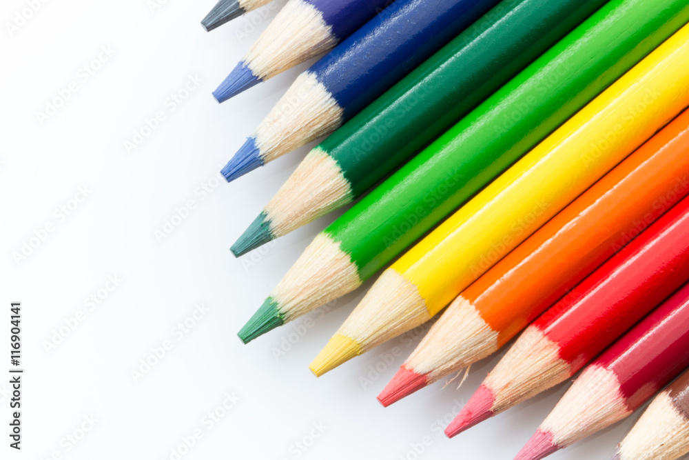 Colored pencils angled on a white background. Colored pencils angled on a white background.
