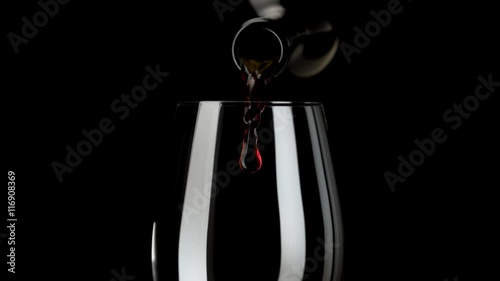 Camera follows red wine pouring into glass. Shot with high speed camera, phantom flex 4K. Slow Motion. 
