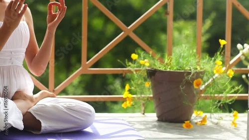 Girl Doing Yoga Meditation Lotus Namaste Outdoors White Suit Sitting Asana Mat Balcony Roof of the House. Summer, India, Himalayas
