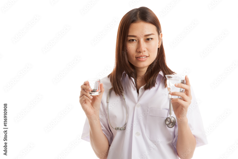 Young Asian female doctor with water and medicine. Young Asian female doctor with water and medicine.