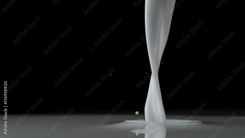 Close-up milk being poured. Shot with high speed camera, phantom flex 4K. Slow Motion. 