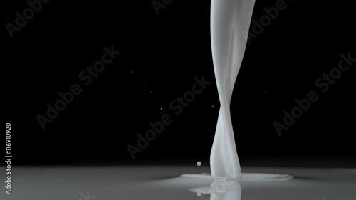 Close-up milk being poured. Shot with high speed camera, phantom flex 4K. Slow Motion. 