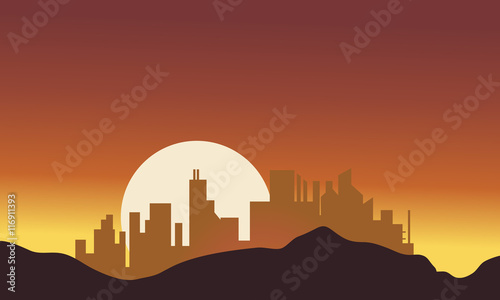 Silhouette of city with big moon
