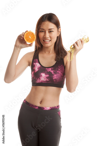 Asian healthy girl on diet with orange fruit and measuring tape.